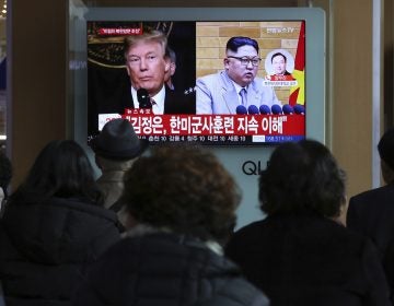 People watch a TV screen showing North Korean leader Kim Jong Un and U.S. President Donald Trump at the Seoul Railway Station in Seoul, South Korea  (Ahn Young-joon/AP Photo)