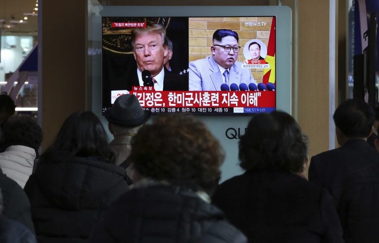 People watch a TV screen showing North Korean leader Kim Jong Un and U.S. President Donald Trump at the Seoul Railway Station in Seoul, South Korea  (Ahn Young-joon/AP Photo)