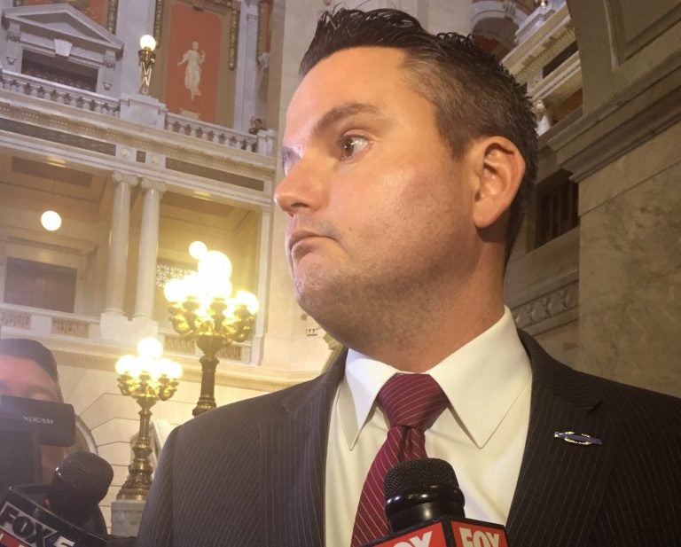 Pennsylvania state Rep. Nick Miccarelli is questioned by reporters at the county courthouse in Wilkes-Barre Thursday.  A lawmaker who alleges  Miccarelli  pulled a gun and threatened to kill her has been granted a three-year protective order against him. State Rep. Tarah Toohil alleges Miccarelli was physically abusive during a relationship that ended several years ago.  She also says he's been physically intimidating her at the Capitol this year. (AP Photo/Michael Rubinkam)