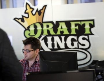 In this Thursday, Jan. 11, 2018, file photo, employees work at the DraftKings office in Boston. The explosion in popularity of daily fantasy sports over the last decade has created a generation of sports fans more attuned to gauging individual player statistics than how two teams may fare against each other, the challenge at the heart of traditional sports wagering. (Charles Krupa/AP Photo, file)