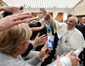 Pope Francis is cheered by faithful during an audience with health workers, in the Paul VI hall at the Vatican, Saturday, March 3, 2018. (L'Osservatore Romano/ANSA via AP)