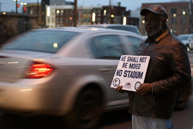 Community members, activist and students shut down a town hall meeting about the proposed $130 million, 35,000 seat stadium on Temple's campus, on Tuesday. (Bastiaan Slabbers/for WHYY)