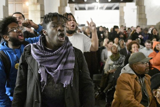 Student Philip Gregory, a Stadium Stumpers member, protests during a town hall meeting about the proposed $130 million, 35,000 seat stadium on Temple's campus, on Tuesday. (Bastiaan Slabbers/for WHYY)