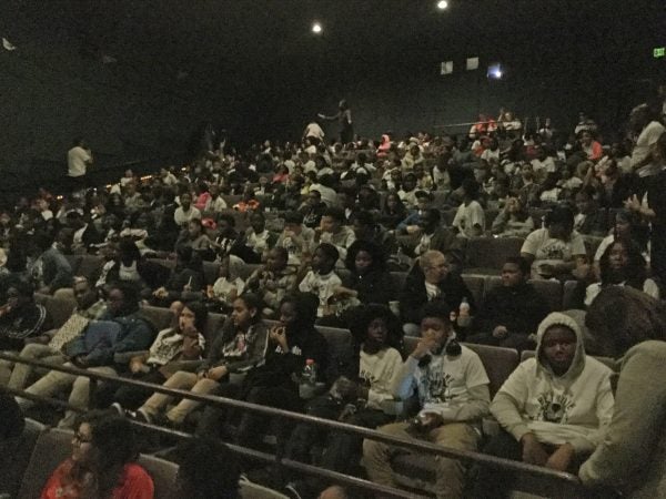 Students from Mary McLeod Bethune Elementary School wait in anticipation to see Black Panther. (Kyrie Greenberg/for WHYY)
