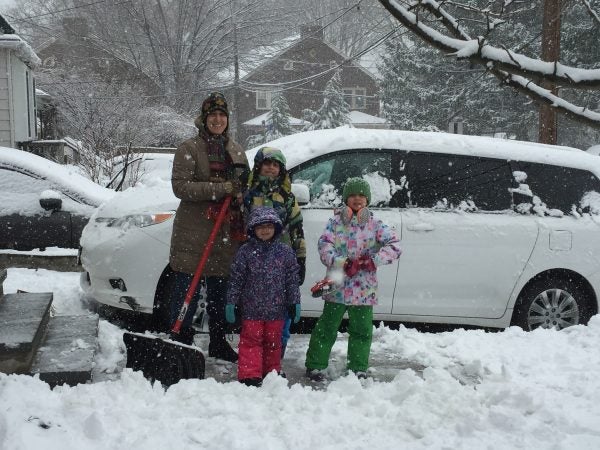 Shoveling is a family affair for the Bacchiocchis in Glenside, as mom Vivianna (from left) gets help from Massimo, Veronica and Sveva. (Nora O'Dowd/WHYY)