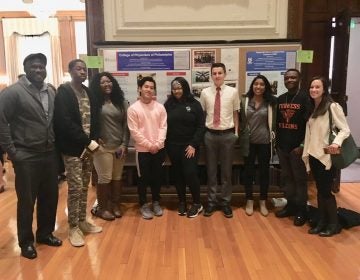 This year’s College of Physicians Teva interns presenting a poster on gun violence. (Courtesy of Jacqui Bowman)