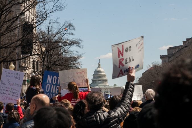 Demonstrators flood the streets downtown Washington D.C during the March for Our Lives Saturday afternoon. (Brad Larrison for WHYY)