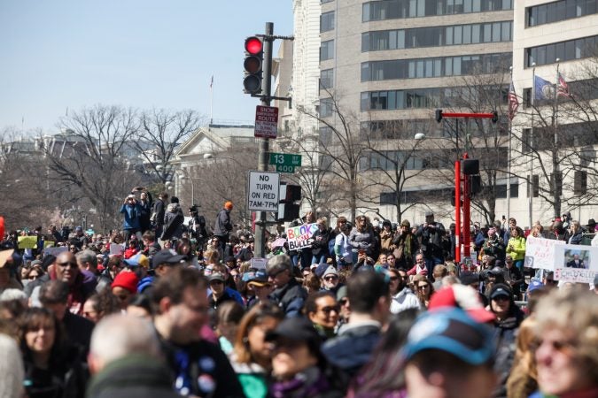 Demonstrators flood the streets downtown Washington D.C during the March for Our Lives Saturday afternoon. (Brad Larrison for WHYY)