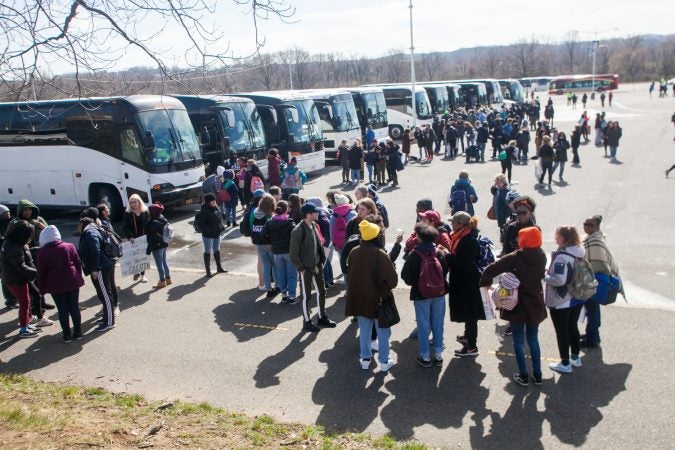 Students from Science Leadership Academy Beeber Campus prepare to make their way to the March for Our Lives in Washington D.C Saturday. (Brad Larrison for WHYY)
