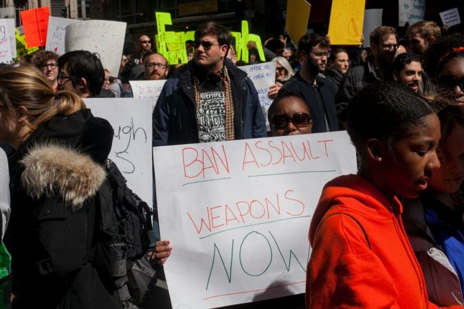 Stephanie Devaughn, whose daughter attends Science Leadership Academy Beeber Campus holds a sign calling for an assault weapons ban at the March for Our Lives in Washington D.C. (Brad Larrison for WHYY)