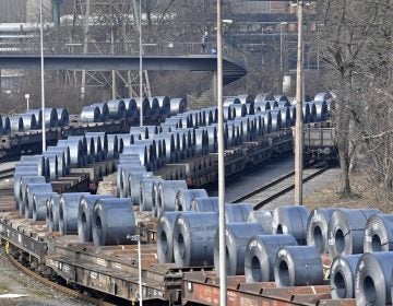 Steel coils sit on rail cars leaving the Thyssenkrupp steel factory in Duisburg, Germany