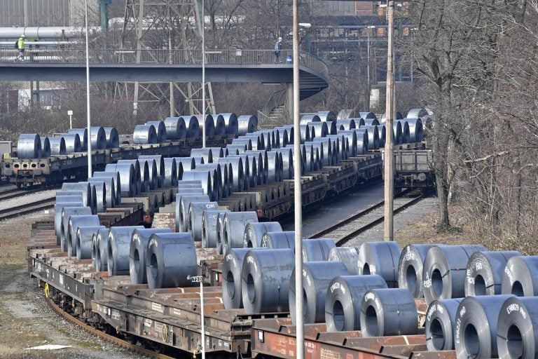 Steel coils sit on rail cars leaving the Thyssenkrupp steel factory in Duisburg, Germany