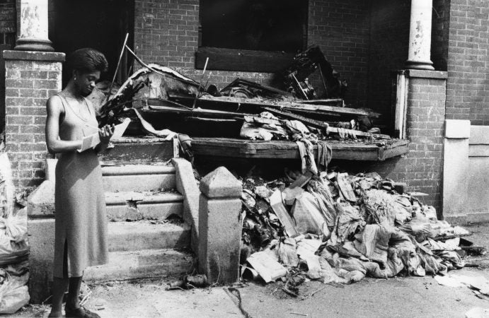 A woman outside a Strawberry Mansion Home in 1979.