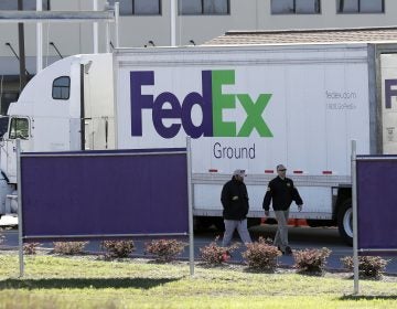 Bureau of Alcohol, Tobacco, Firearms and Explosives agents investigate the scene at a FedEx distribution center where a package exploded on Tuesday, in Schertz, Texas. Authorities believe the package bomb is linked to the recent string of Austin bombings.