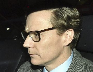Chief Executive of Cambridge Analytica (CA) Alexander Nix, leaves the firm's offices in central London on Tuesday. He was suspended amid a controversy about the company's use of social media data.