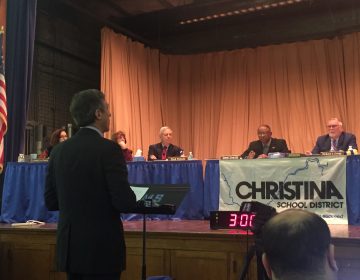 Gov. John Carney appeared before the Christina School District board in February and made his pitch for approval of the partnership. The Memorandum of Understanding to consolidate five schools passed 4 to 2 with one abstention. (Cris Barrish/WHYY)