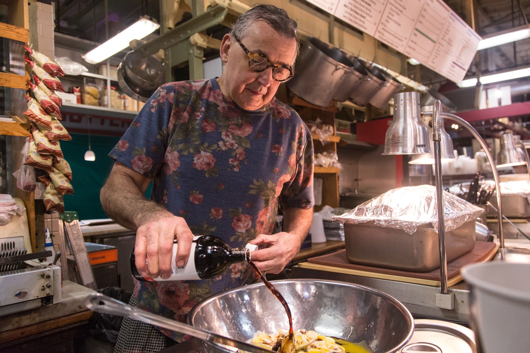 Around 5:30 a.m., co-owner Andy Wash joins the preparations, beginning his day with his four-cheese kugel, which is a sweet, cheese, noodle dish which has its roots in old Jewish cooking. 