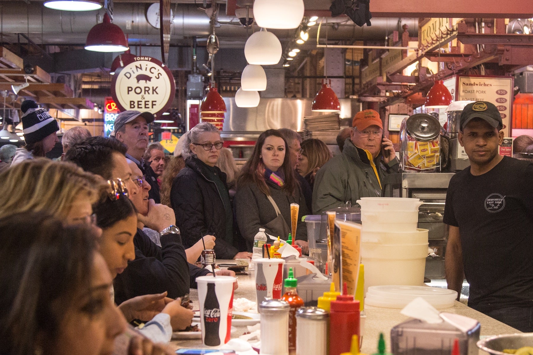 By noon the line for sandwiches wraps around the deli, leaving waiting patrons to ogle the food being eaten by those who have found counter space. 