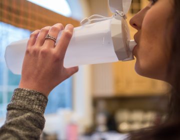 This teenager is part of a medical study at CHOP to see if drinking a certain amount of water per day can help decrease a certain type of kidney stones. The special water bottle has a 