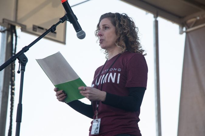 Marjory Stoneman Douglas High School alumna, Rebeca Salus, talks to the crowd gathered at the Philadelphia March for Our Lives, March 24, 2018. (Emily Cohen for WHYY)