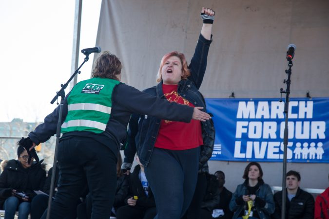 A protester who wanted the focus to be on police brutality more specifically is removed from the stage during the Philadelphia 