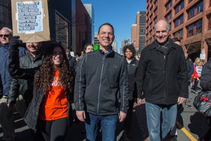 Pennsylvania Attorney General Josh Shapiro, (center), marches with his daughter, Sophia, 16, and Senator Bob Casey at the Philadelphia March for Our Lives, March 24, 2018. (Emily Cohen for WHYY)