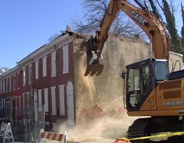 Demolition work begins on some abandoned homes on Bennett St. in Wilmington. (Dan Rosenthal/WHYY)