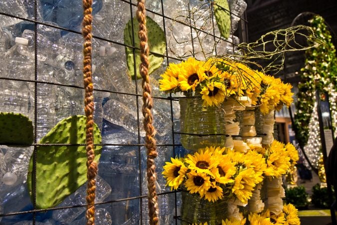 Sunflowers, corn husks and water bottles on display at the 2018 Flower Show. (Kimberly Paynter/WHYY)