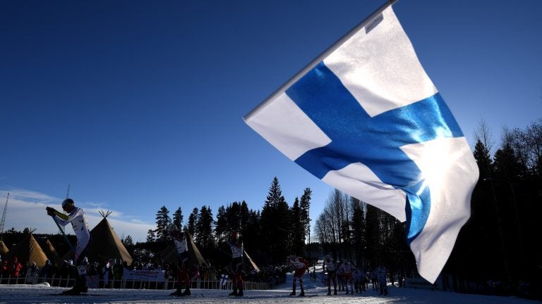 A fan waves the Finnish flag during the Nordic World Ski Championships last year. Finland is No. 1 on the annual World Happiness Report, released Wednesday. (Matthias Hangst/Getty Images)