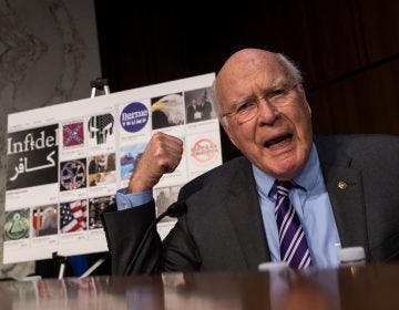 With examples of Russian-created Facebook pages behind him, Sen. Patrick Leahy, D-Vt., questions witnesses during a 2017 Senate hearing on Russian-backed ads on social media in the 2016 election. Now, the Federal Election Commission is looking into increasing disclosure requirements for online ads. (Drew Angerer/Getty Images)