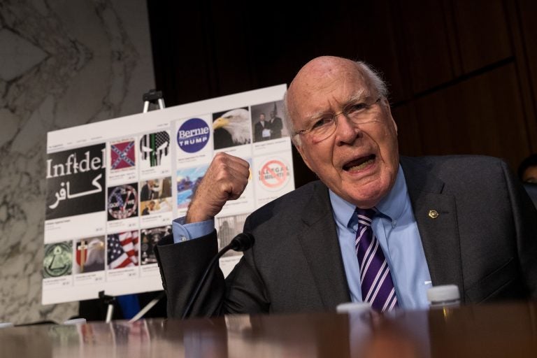 With examples of Russian-created Facebook pages behind him, Sen. Patrick Leahy, D-Vt., questions witnesses during a 2017 Senate hearing on Russian-backed ads on social media in the 2016 election. Now, the Federal Election Commission is looking into increasing disclosure requirements for online ads. (Drew Angerer/Getty Images)