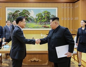 In this handout image provided by the South Korean Presidential Blue House, Chung Eui-Yong (left), head of the presidential National Security Office shakes hands with North Korean leader Kim Jong-Un during their meeting on Monday in Pyongyang.
(Handout/Getty Images)