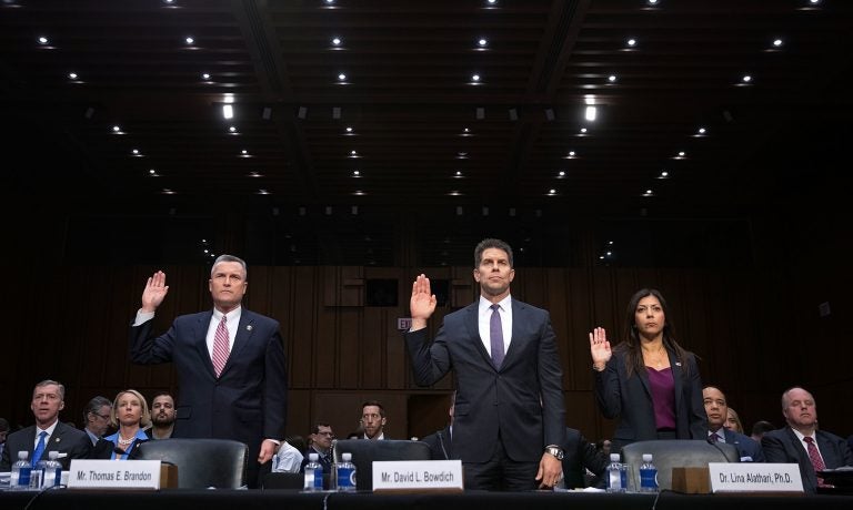Acting Director of the Bureau of Alcohol, Tobacco, Firearms and Explosives Thomas Brandon (left), Acting Deputy Director of the Federal Bureau of Investigation David Bowdich (center) and U.S. Secret Service's National Threat Assessment Center head Lina Alathari are sworn in before testifying to the Senate Judiciary Committee on Wednesday.
(Chip Somodevilla/Getty Images)
