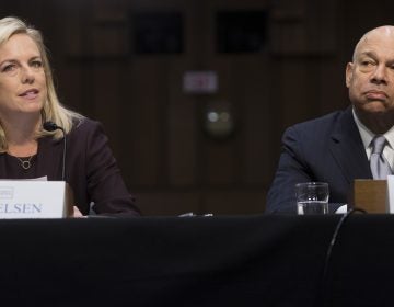 Secretary of Homeland Security Kirstjen Nielsen (left) and former Secretary of Homeland Security Jeh Johnson (right) testify about election security during a Senate intelligence committee hearing on Capitol Hill Wednesday. (Saul Loeb/AFP/Getty Images)