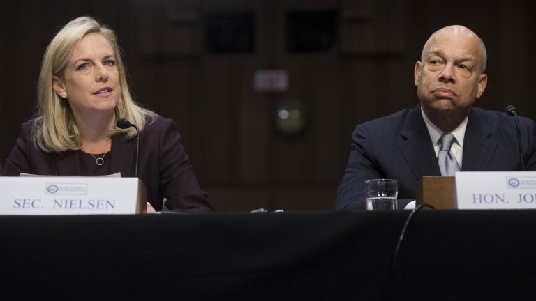 Secretary of Homeland Security Kirstjen Nielsen (left) and former Secretary of Homeland Security Jeh Johnson (right) testify about election security during a Senate intelligence committee hearing on Capitol Hill Wednesday. (Saul Loeb/AFP/Getty Images)