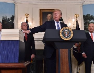 President Trump speaks about the recently passed spending bill at the White House on Friday. Trump threatened to veto the bill before later signing it.