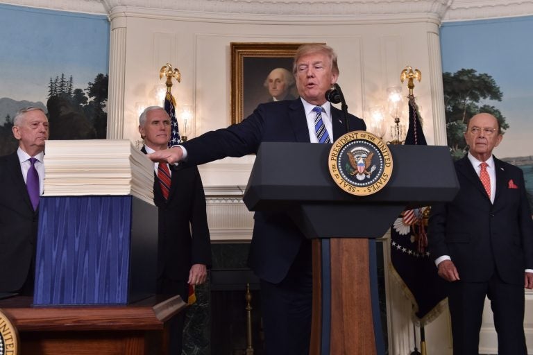 President Trump speaks about the recently passed spending bill at the White House on Friday. Trump threatened to veto the bill before later signing it.