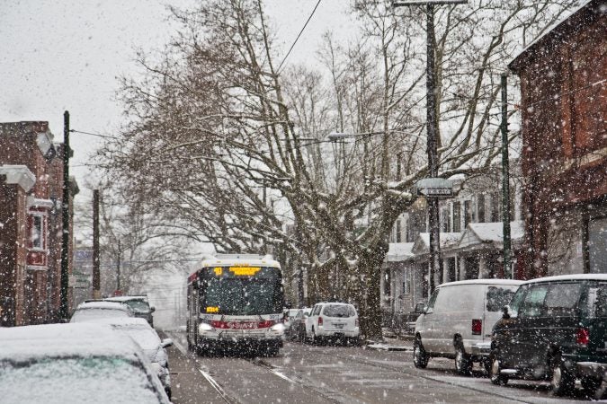 Heavy wet snow falls in West Philadelphia Wednesday morning. (Kimberly Paynter/WHYY)