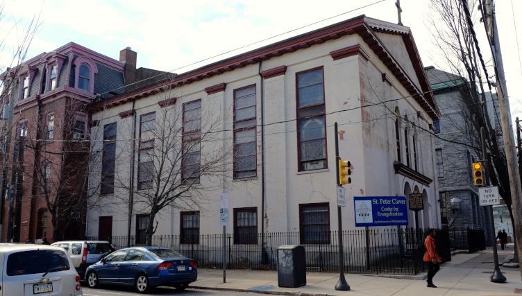 St. Peter Claver anchors the southwest corner of 12th and Lombard, flanked by a rectory (left) and school (right)