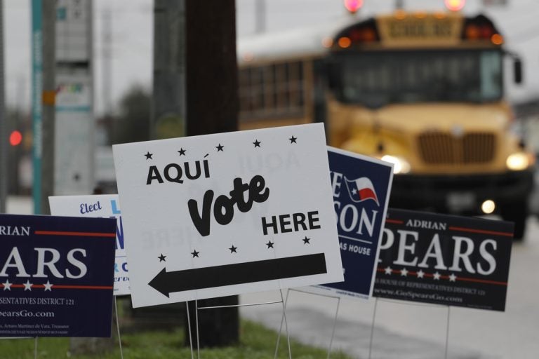 Signs mark a polling site in San Antonio, Texas