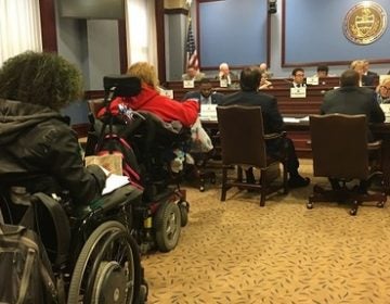 A number of protesters in wheelchairs attended the committee hearing on the bills to create new work requirements and other welfare restrictions. (Katie Meyer/WITF)