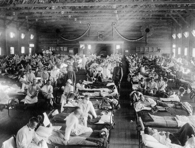 Patients at an Army ward in Kansas during the influenza epidemic of 1918. About 675,000 Americans died of the flu known as La Grippe. (NYPL/Science Source/Getty Images)