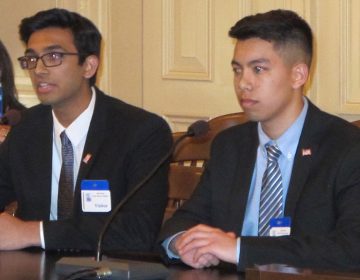 High school students Varun Seetamraju and Jason Lam tell lawmakers the legislation would empower thousands of first-time voters to participate in primary elections.  (Phil Gregory/WHYY)