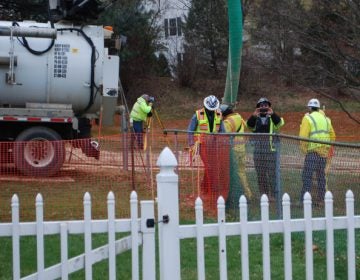 Workers and contractors for Sunoco Pipeline begin an ‘additional investigation’ of geological conditions behind homes at Lisa Drive, West Whiteland Township, Chester County where the company has been drilling for construction of the Mariner East 2 and 2X pipelines. (Jon Hurdle/StateImpact Pennsylvania)