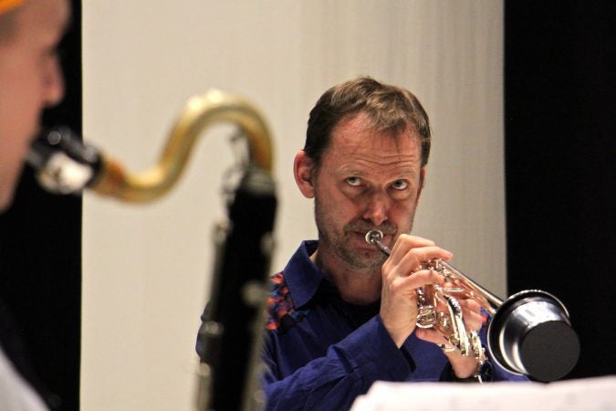 Marco Blaauw plays the trumpet and coaches the trio during a rehearsal for Schönheit (Beauty). (Emma Lee/WHYY)