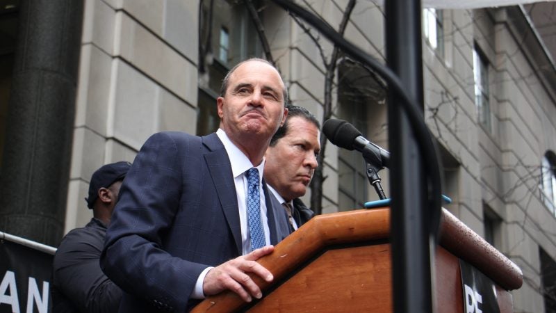 Brian McMonagle, one of Meek Mill's lawyers, tells the crowd outside the Criminal Justice Center that the rapper will get a new trial but will not yet be freed from prison. (Emma Lee/WHYY)