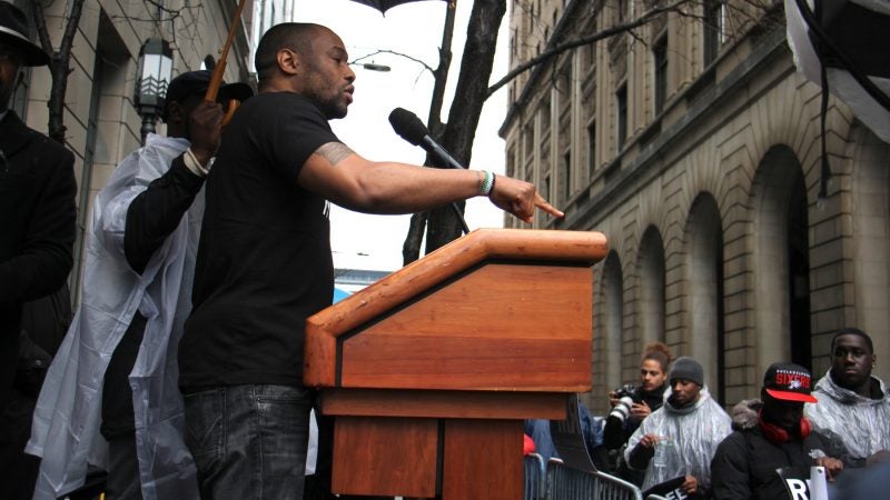 Temple professor Mark Lamont Hill calls for criminal justice reform during a rally for Meek Mill at the Criminal Justice Center. (Emma Lee/WHYY)