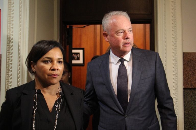 Starbucks chief executive officer Kevin Johnson and chief operating officer Rosalind Brewer emerge from a meeting with Philadelphia Mayor Jim Kenney that they said was 