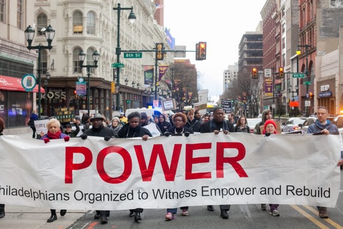 Demonstrators march  toward City Hall in response to an incident last week where two black men were arrested in a Center City Starbucks. (Brad Larrison for WHYY)