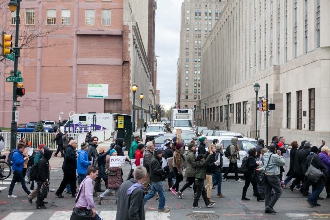 Demonstrators march  toward City Hall in response to an incident last week where two black men were arrested in a Center City Starbucks. (Brad Larrison for WHYY)